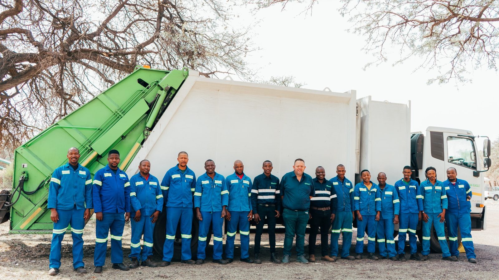 African Eagle operational team standing in front of a waste collection vehicle