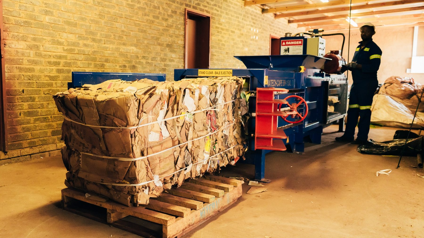 Compressed recyclable cardboard produced at an African Eagle recycling facility