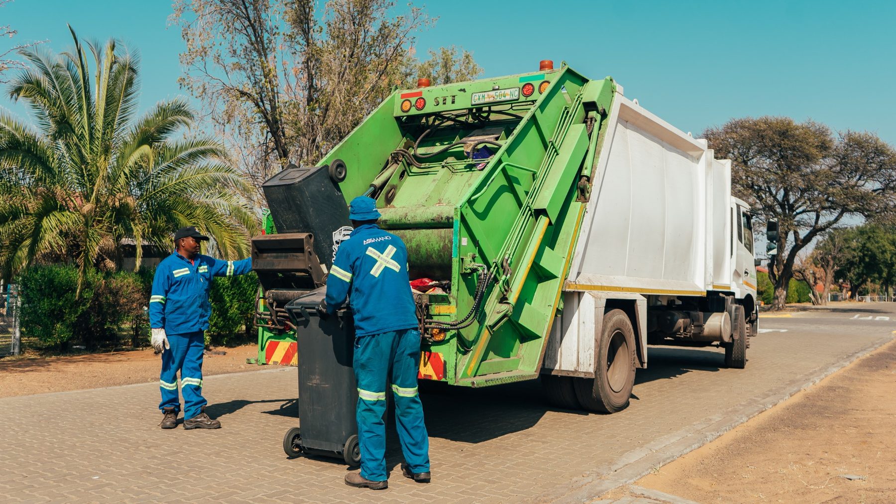 Waste collection employees at work
