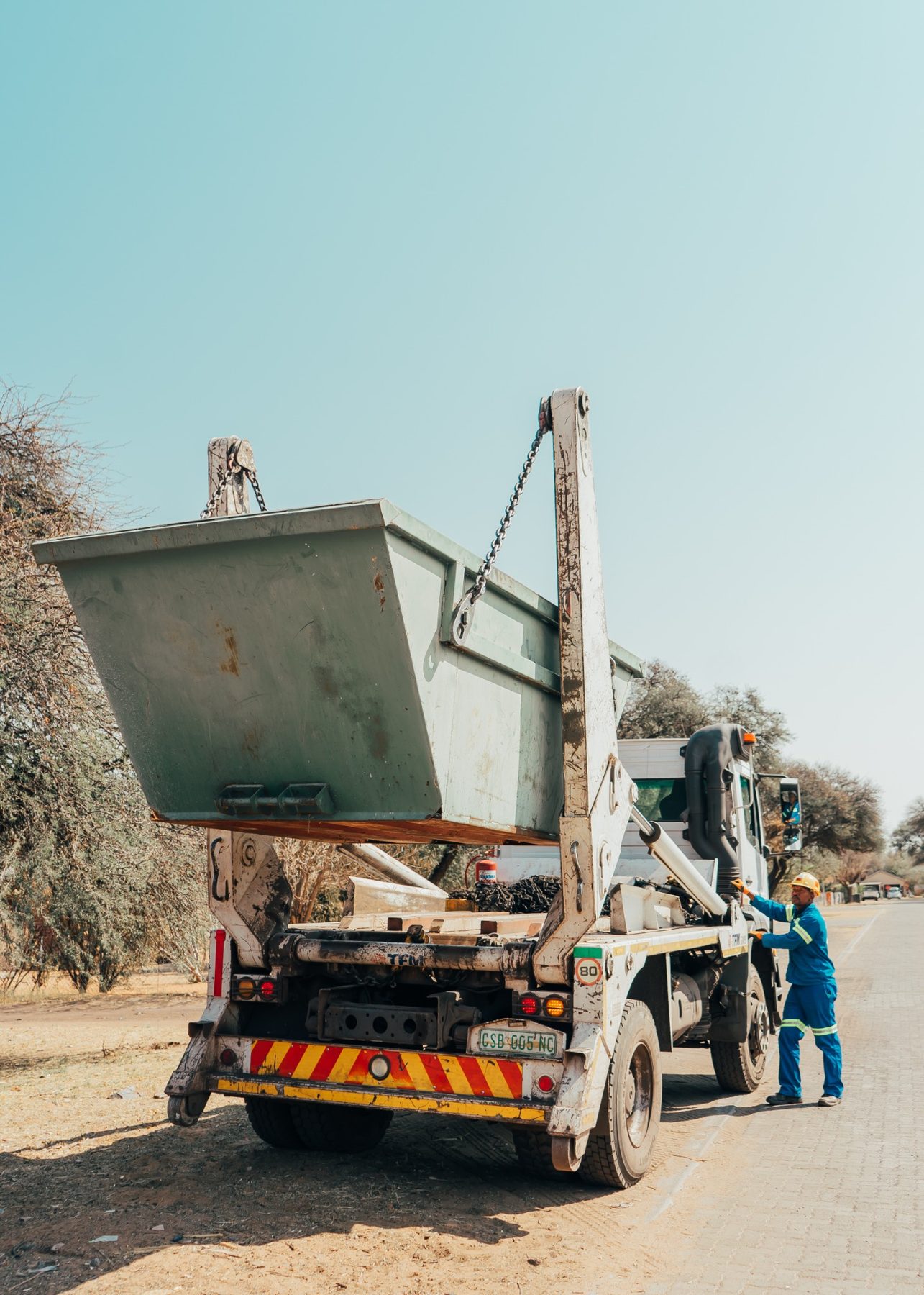 Waste skip being loaded onto a collection truck